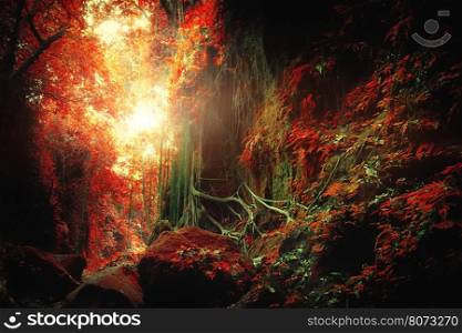 Surreal colors of fantasy landscape at mystical tropical mossy forest with amazing jungle plants. Concept for mysterious nature and fairy tale background