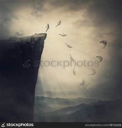 Surreal scene, determined man jumping from the edge of a cliff, fighting his fears, being confident the wings will unfold in flight. Free fall before flying. Self confidence concept, way to success