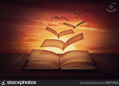 Surreal scene with book pages transforms into magical flying birds, against sunset sky background. Unwritten, blank textbook sheets escapes like poetry thoughts. Knowledge concept, wisdom symbol