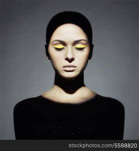 Surrealist portrait of young lady with art makeup
