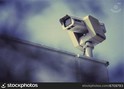 Surveillance camera on a wall