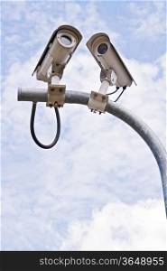 Surveillance Security Camera or CCTV on blue sky