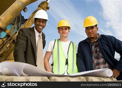 Surveyor and construction workers on site, portrait