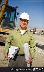Surveyor holding blueprints on construction site, portrait