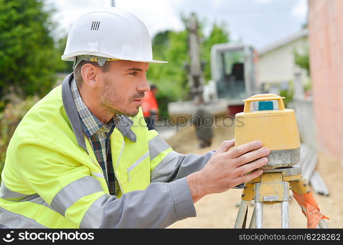 Surveyor taking some measurements