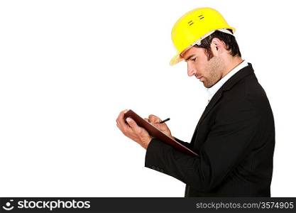 Surveyor writing on a clipboard
