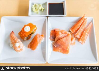 Sushi an sashimi in white dish