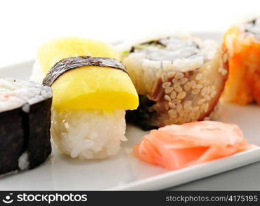 sushi assortment on a white dish, close up