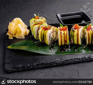 Sushi cheese rolls on black slate