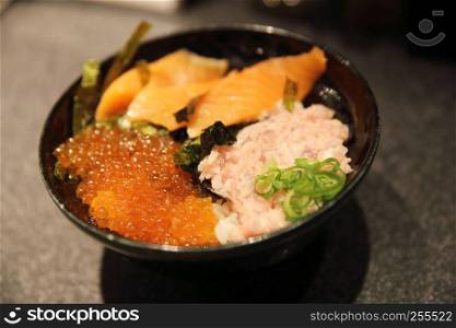 Sushi don , raw salmon tuna and caviar on rice