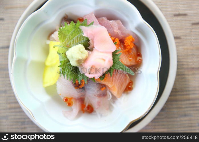 Sushi don , raw sushi salmon tuna octopus and egg on rice , Japanese food