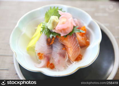 Sushi don , raw sushi salmon tuna octopus and egg on rice , Japanese food