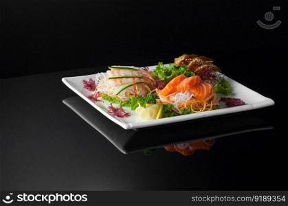 sushi in a white plate on a dark  background with reflection. sushi in a plate on a black background