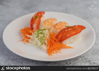 Sushi is beautifully arranged on the plate.