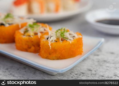 Sushi is beautifully arranged on the plate.