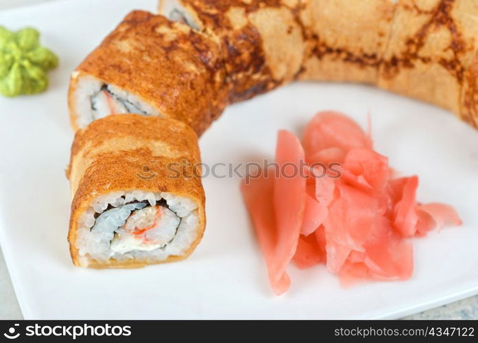 Sushi - made of crab meat, cheese, pancake outside