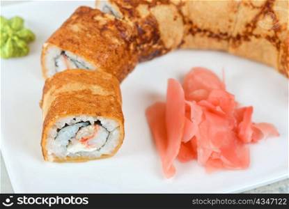 Sushi - made of crab meat, cheese, pancake outside