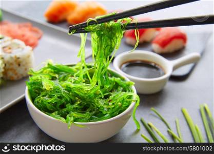 Sushi Maki and Niguiri California roll with seaweed chuka salad soy sauce