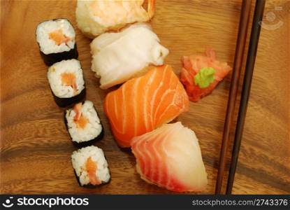 sushi meal with nigiris/makis (salmon, swordfish, shrimp, octupus) and chopsticks