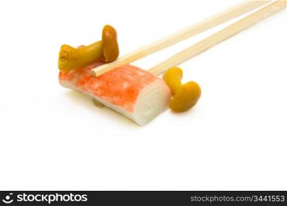 sushi on chopstick with mushrooms
