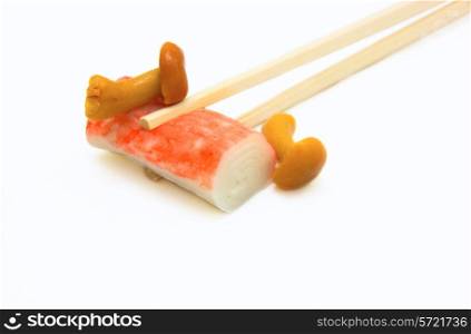 sushi on chopstick with mushrooms