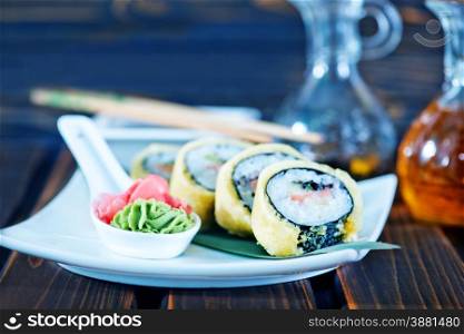 sushi on plate and on a table