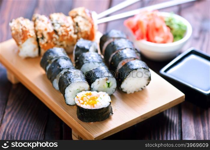 sushi on tray and on a table