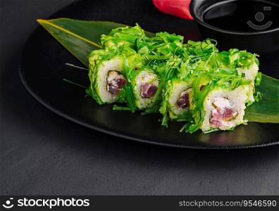 Sushi plate on black stone. japanese food.