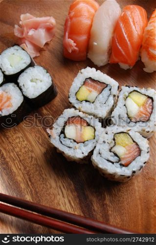 "Sushi plates "Uramaki, Hossomaki, Nigiri, Ginger" and wooden chopsticks"