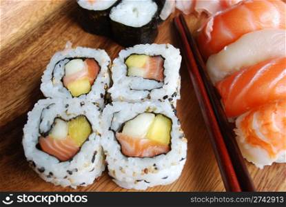 "Sushi plates "Uramaki, Hossomaki, Nigiri, Ginger" and wooden chopsticks"