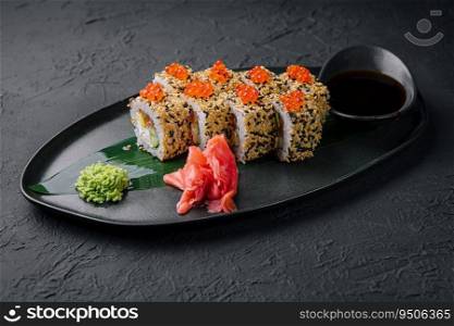Sushi roll sprinkled with sesame seeds
