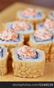 Sushi roll with fresh cream cheese and tobico