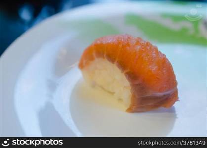 Sushi Roll with salmon on white dish. salmon sushi