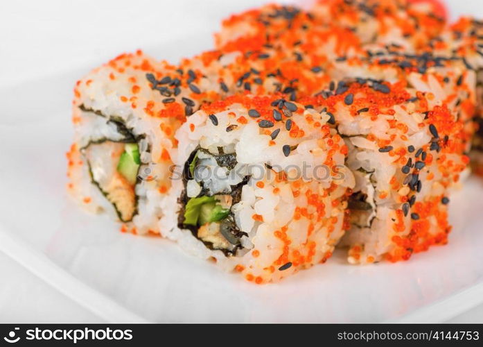 Sushi rolls at plate isolated on a white