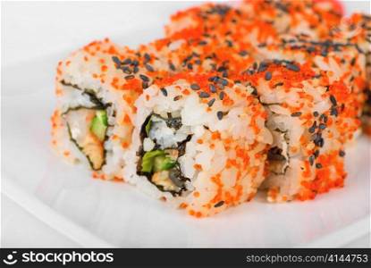 Sushi rolls at plate isolated on a white