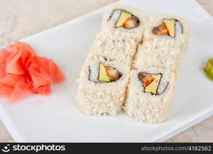 Sushi rolls at plate isolated on a white