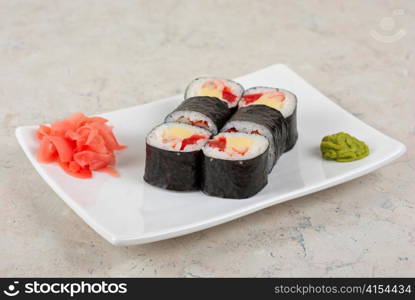 Sushi rolls made of crab meat, cheese, and tomato