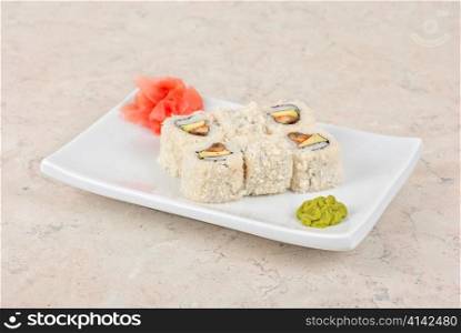 Sushi rolls of rice, omelette, eel and sesame