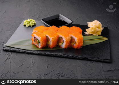 Sushi rolls philadelphia on a black slate