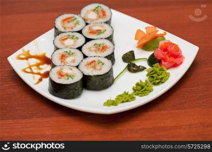 sushi rolls with crabs meat at plate