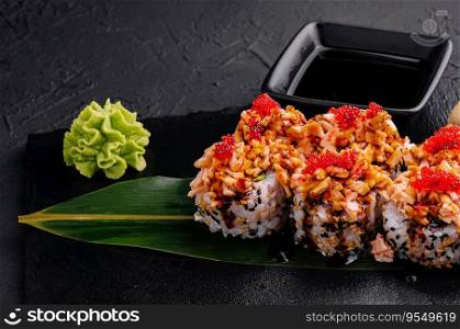 sushi rolls with salmon pieces and red caviar