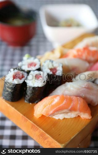 Sushi Set nigiri and sushi maki with tea served on wood and soup , Japanese food