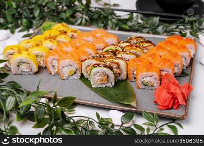 Sushi set of different rolls on big plate