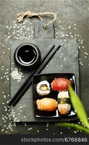 Sushi set on dark vintage background