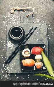 Sushi set on dark vintage background. Sushi set on dark vintage background, flat lay