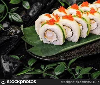 Sushi set with cheese, rice, shrimp and cucumber