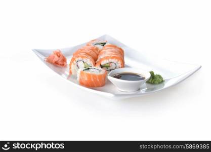 sushi with salmon and avocado on plate
