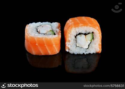 sushi with salmon on black background