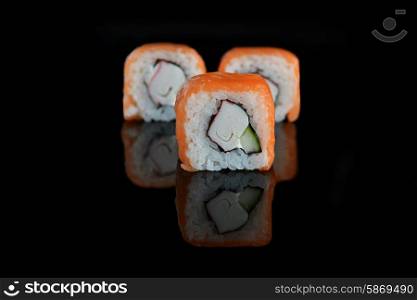 sushi with salmon on black background
