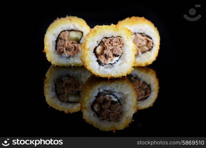 sushi with salmon on black background